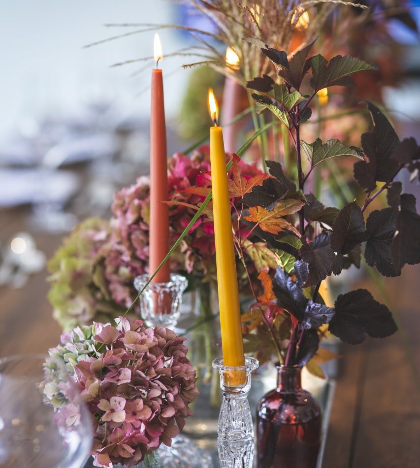 Flowers and candles on table