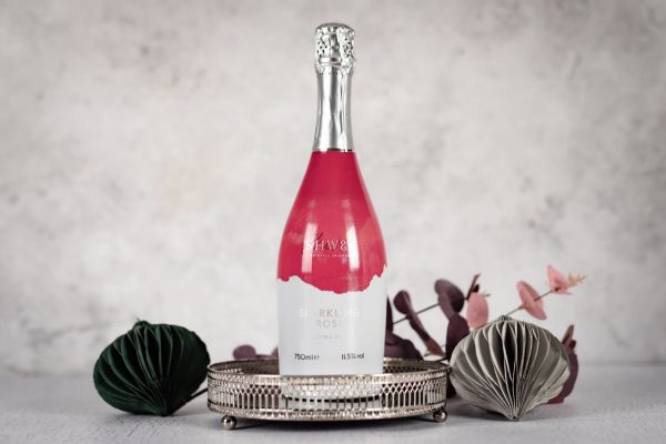 Sparkling Rosé bottle on tray Christmas decorations